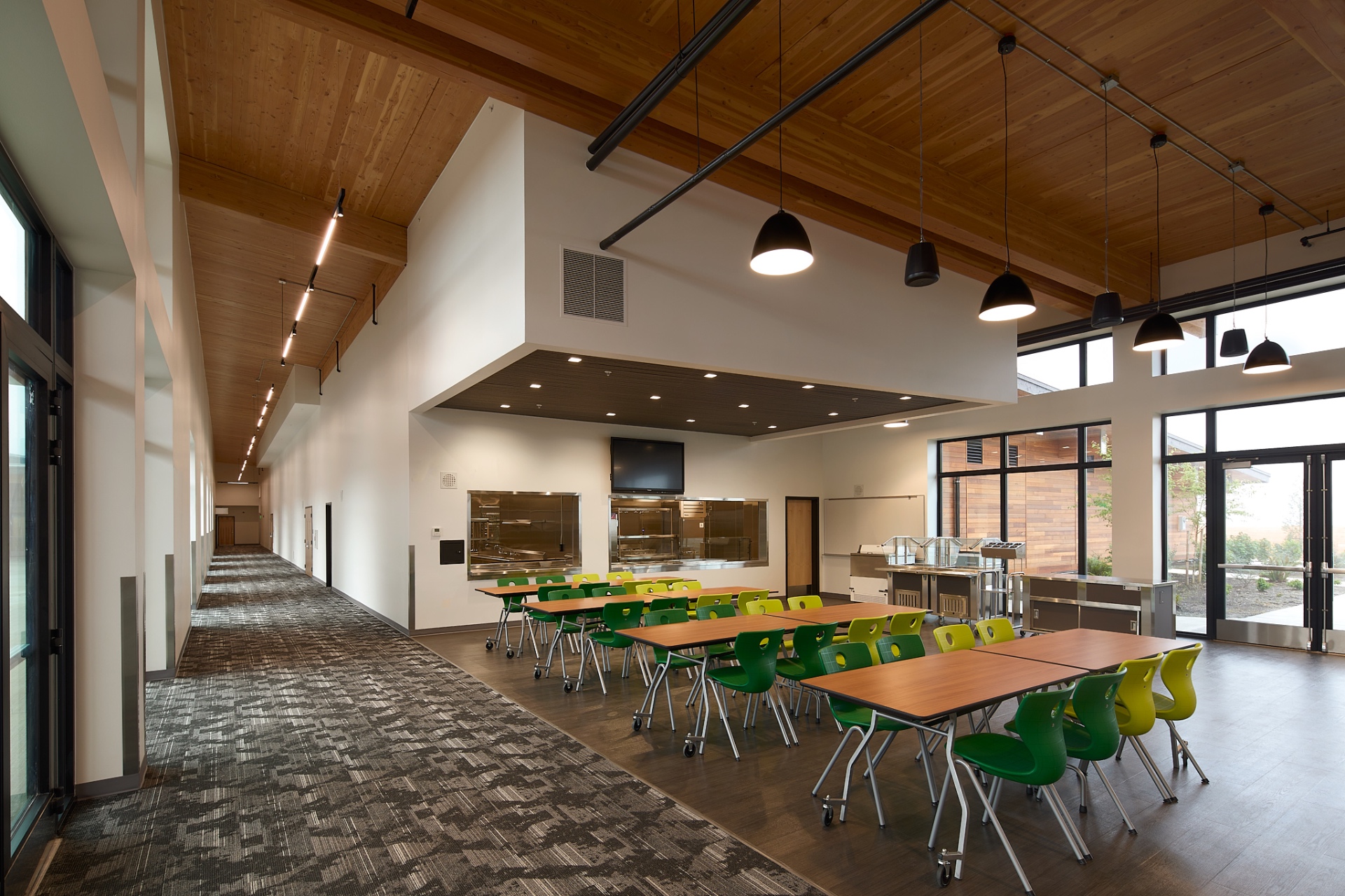Dining commons with vaulted timber ceiling and clerestory windows