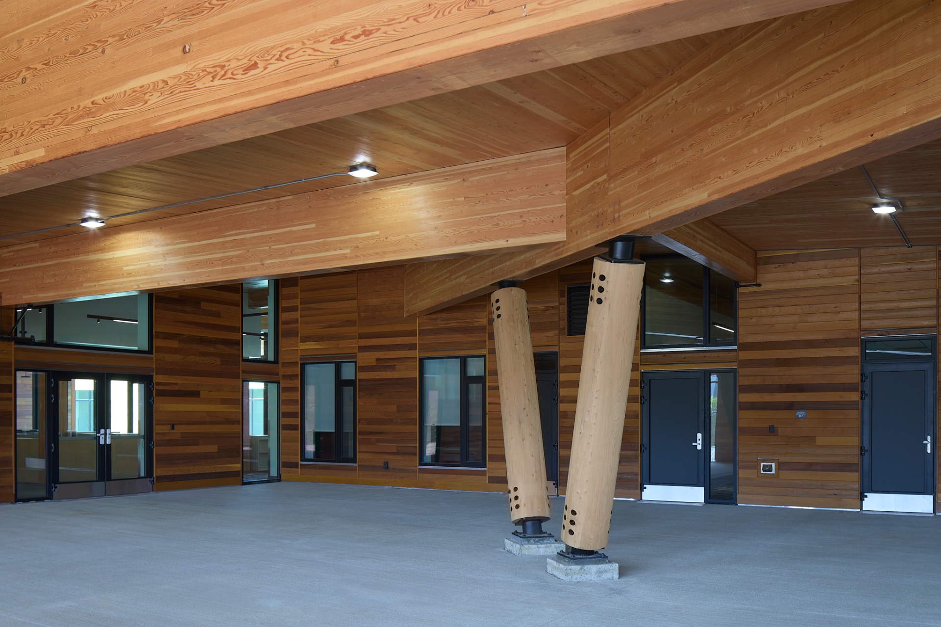 Interior commons under exposed glulam beams and timber ceiling
